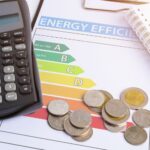 Energy efficiency tips for small businesses - energy efficiency chart, coins and calculator